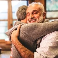 A relieved couple hugging